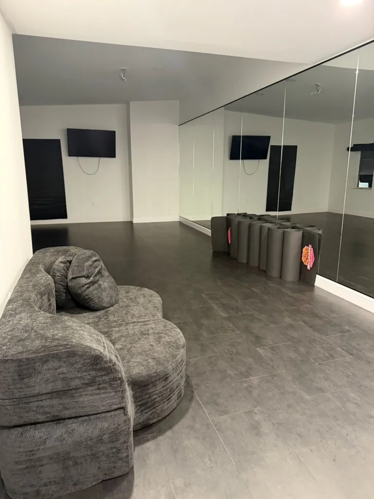 The yoga room, mats ready and mirrored wall for class
